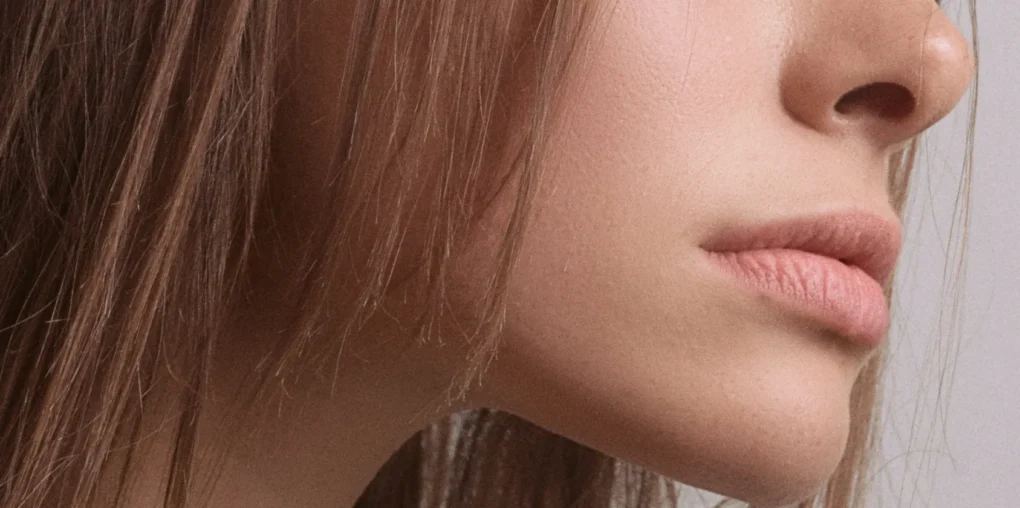 Woman with glowing, healthy skin after using serums for healthy skin